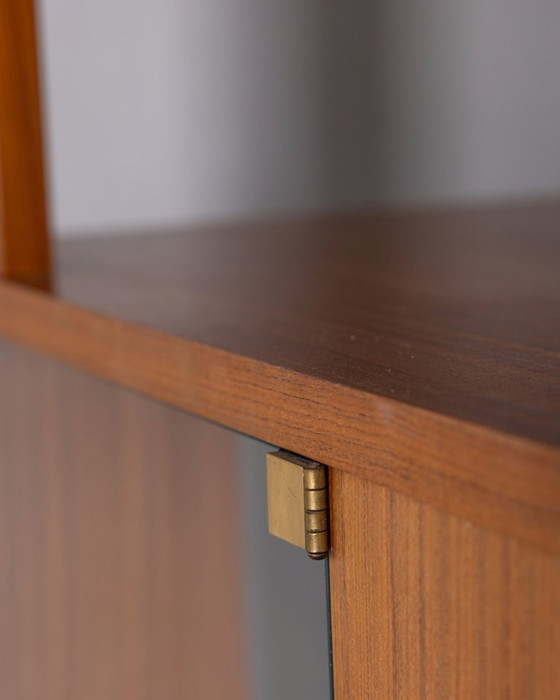 Image 1 of GROTE VINTAGE ITALIAANSE ONTWERP HOUTEN CENTRALE DRAAIBARE BOEKENKAST UIT DE JAREN 60