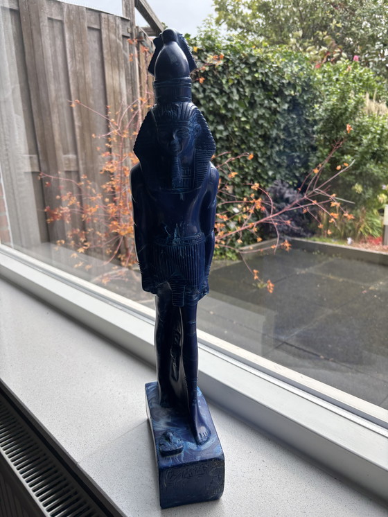 Image 1 of statue of the Egyptian god Thoth.