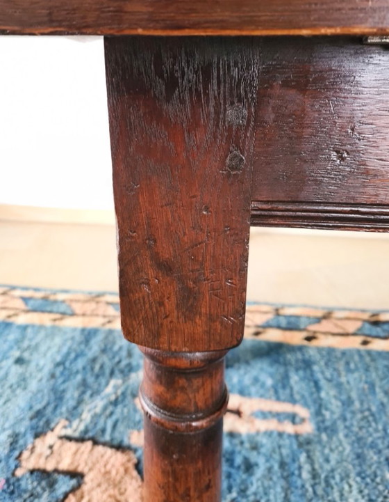 Image 1 of Massief eikenhouten eettafel met 6 bijpassende stoelen 