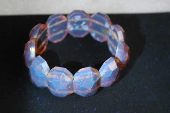 Image 1 of Amber bracelet, intricately cut, 46 grams of honey amber.