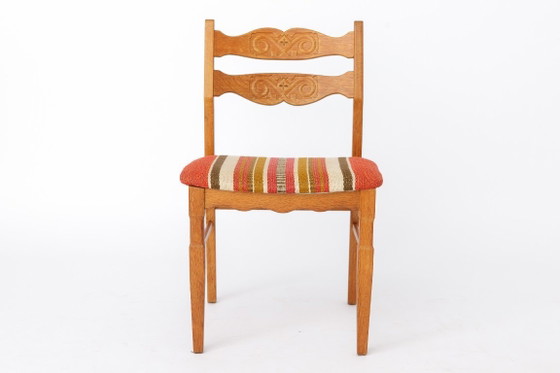 Image 1 of Ensemble de 4 chaises de salle à manger en chêne Henning Kjærnulf | Danois Moderne | EG Mobilier | années 1970