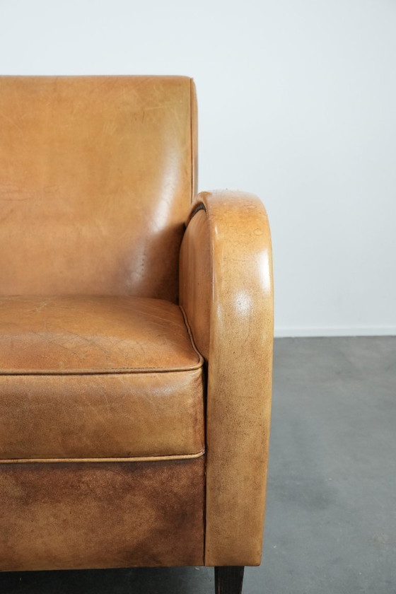 Image 1 of Luxurious armchair made of cowhide leather with a beautiful warm color scheme