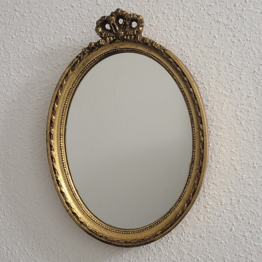 Vintage gold oval bow mirror