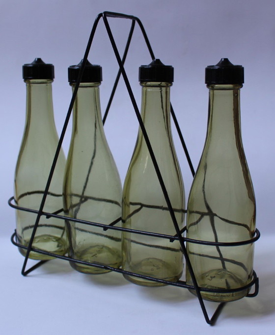 Image 1 of Botellas para aderezo de ensaladas y aceite.