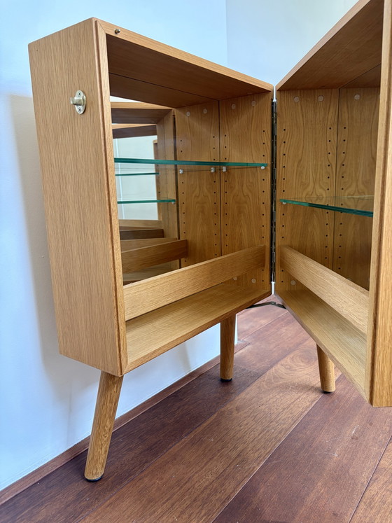 Image 1 of Bolia Oak Bar Cabinet with Glass Shelves & Mirror Interior