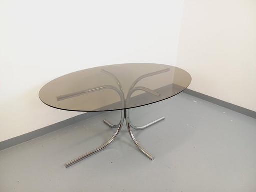 Vintage oval dining table in smoked glass and chrome metal, Space Age style, from the 70s