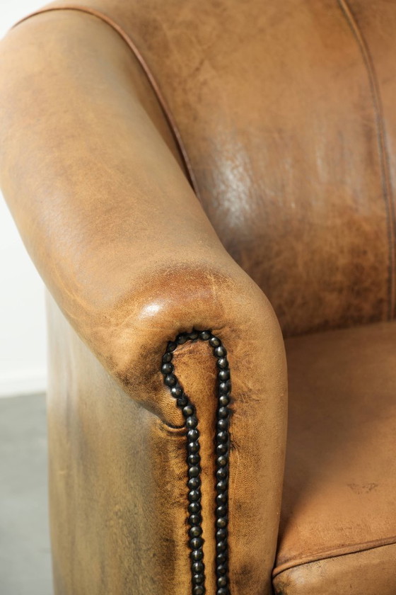 Image 1 of Karaktervolle schapenleren 2 zits bank met een mooie vintage look