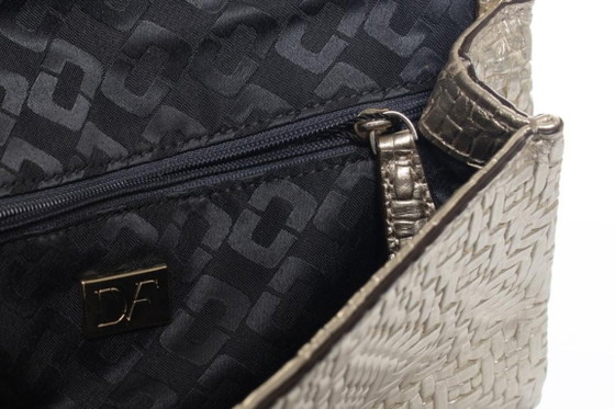 Image 1 of Diane Von Furstenberg, pochette intrecciata dorata