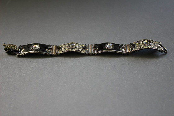 Image 1 of Bracelet by Luigi Briglia, silver-colored, set with clear, faceted stones and signed.