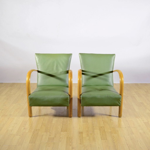 Coppia di Poltrone Art Déco anni '50 con braccioli in faggio e rivestimento a molle in Skai verde