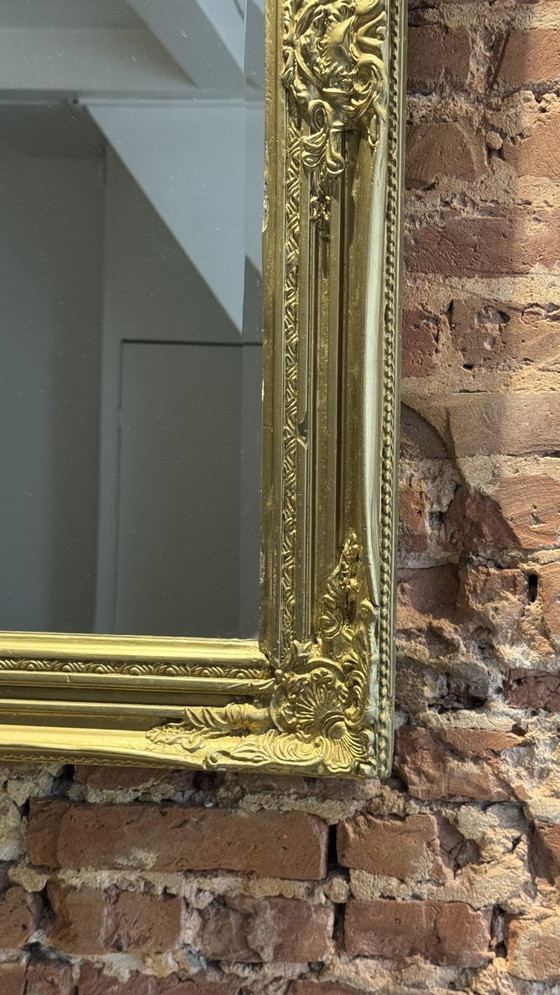Image 1 of Large gold mirror with a baroque wood frame 