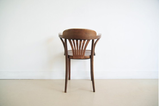 Image 1 of brown wooden bistro chair