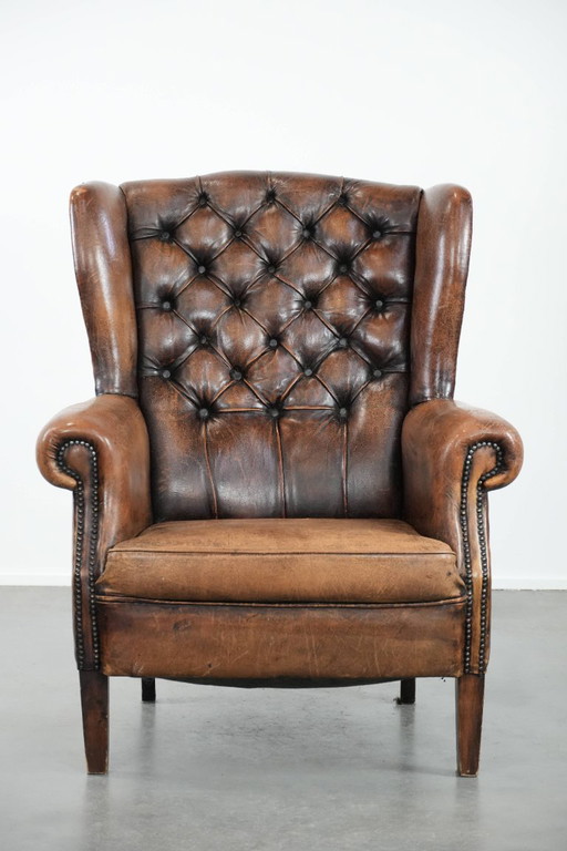 Unique large English-style sheepskin Chesterfield wing armchair