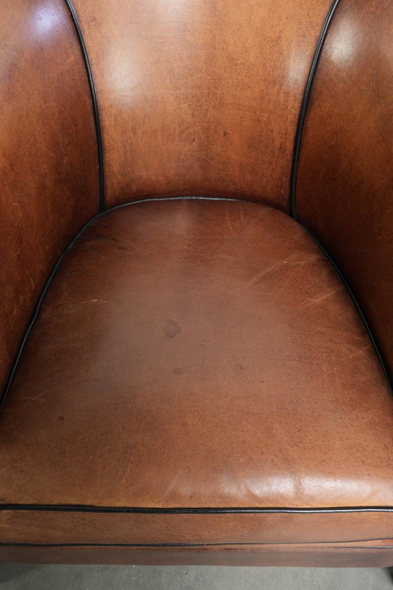 Image 1 of 2x schapenleren Art Deco design clubfauteuil met een mooi patina, zwarte biezen en mooie kleuren