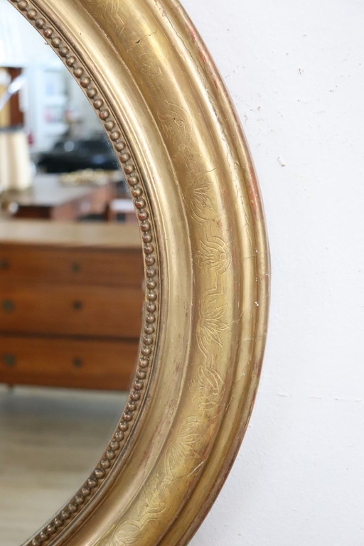 Antique gilt wood oval wall mirror, 19th century