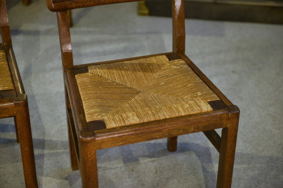 Image 1 of Set van 6 eikenhouten stoelen in de stijl van Pierre Cruège, jaren 1940.