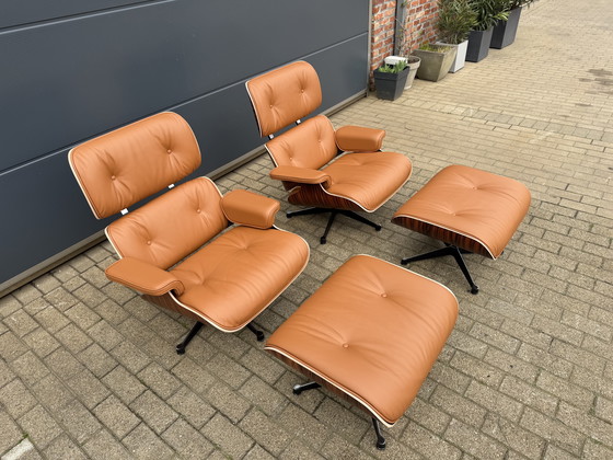Image 1 of 2 poltrone lounge Vitra Eames XL originali con poggiapiedi, in pregiata pelle color cognac e palissandro Santos, NUOVE!!