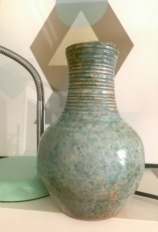 Turquoise glazed terracotta vase