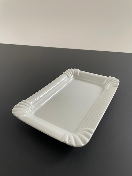 Plate Of White Ceramic In The Shape Of Paper Plate