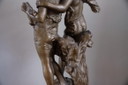 A Gold / Coppery Statue Of A Boy And Girl Young Lovers