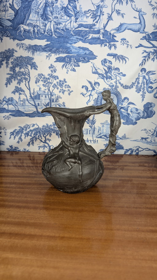 Art Nouveau pewter pitcher with woman and putti design signed Henri Huppé late 19th century