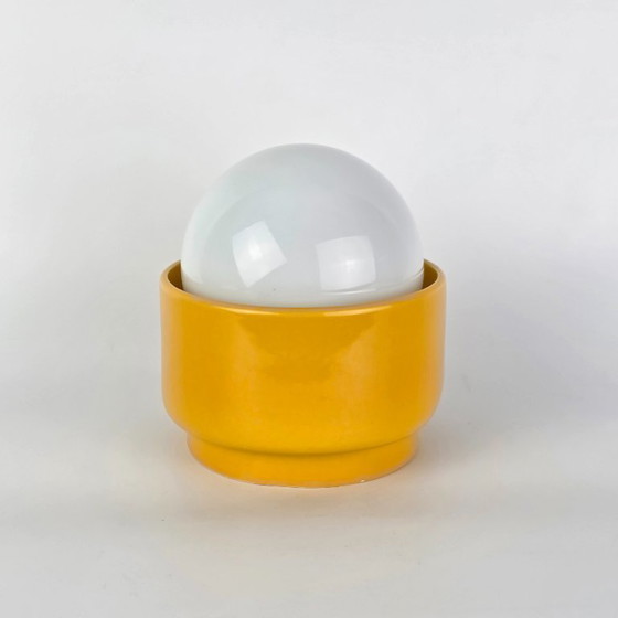 Image 1 of Vintage German ceramic lamp with a glass globe shade. Can be used as a wall lamp, table lamp, or sconce. Yellow. 70s / retro