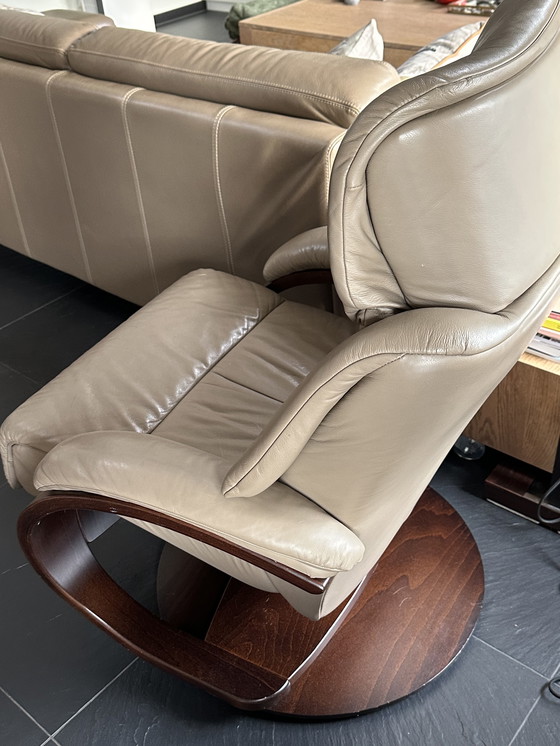 Image 1 of Taupe armchair with footstool