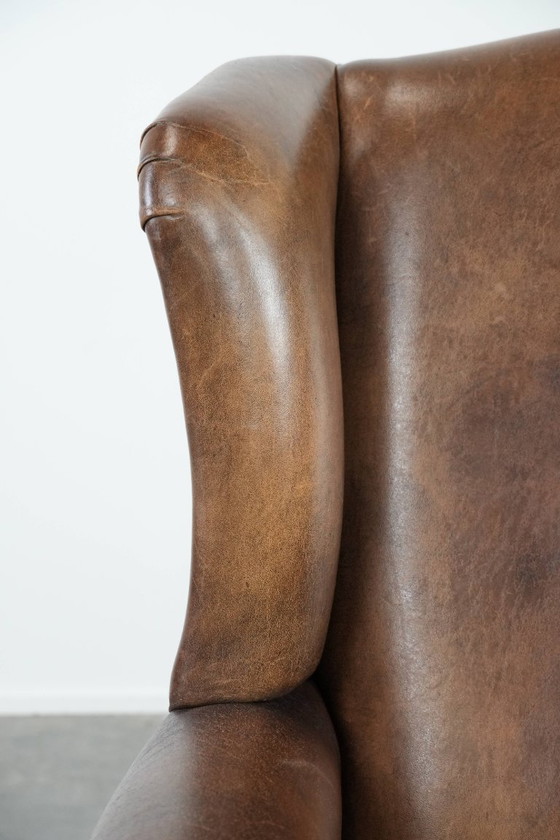 Image 1 of Comfortable vintage sheepskin wing chair with character