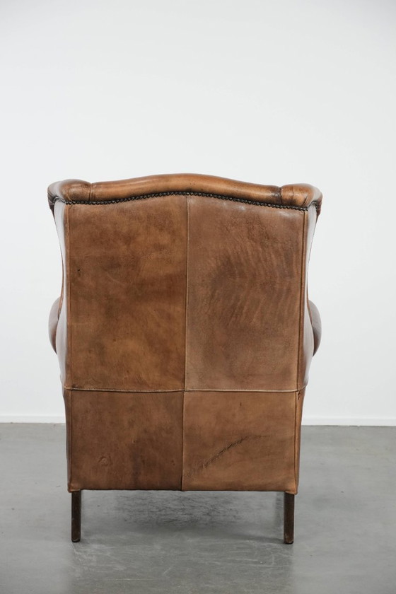 Image 1 of Comfortable vintage sheepskin wing chair with character