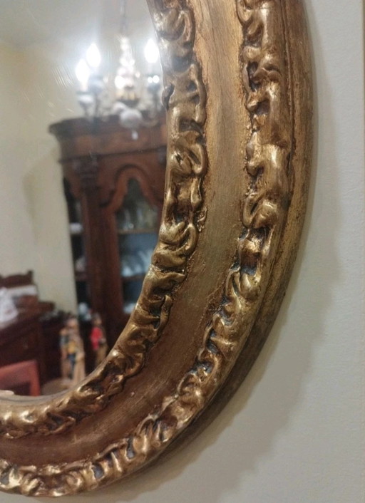 Specchio ovale con antica cornice in foglia oro stile Barocco 