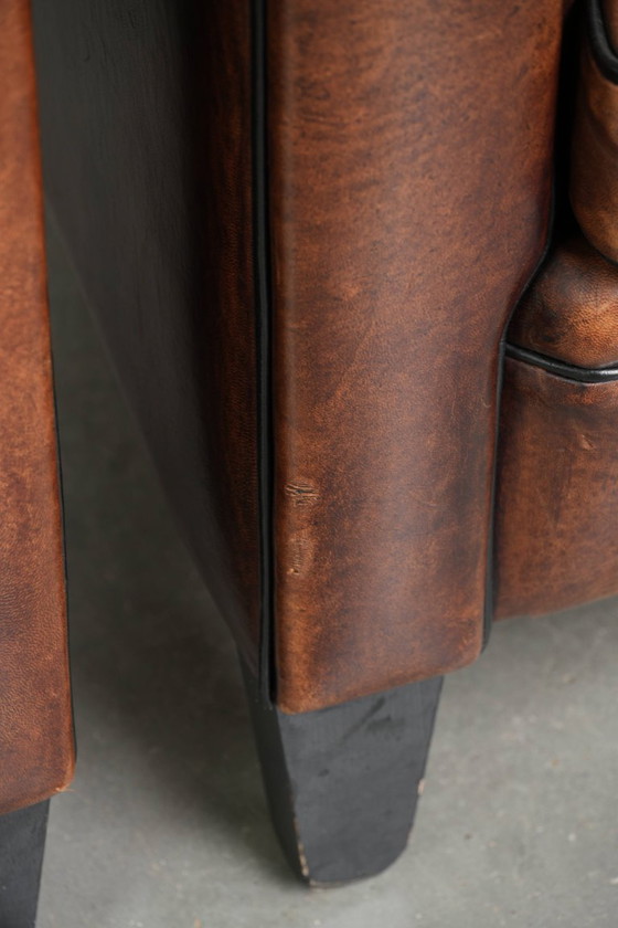 Image 1 of 2x schapenleren Art Deco design clubfauteuil met een mooi patina, zwarte biezen en mooie kleuren