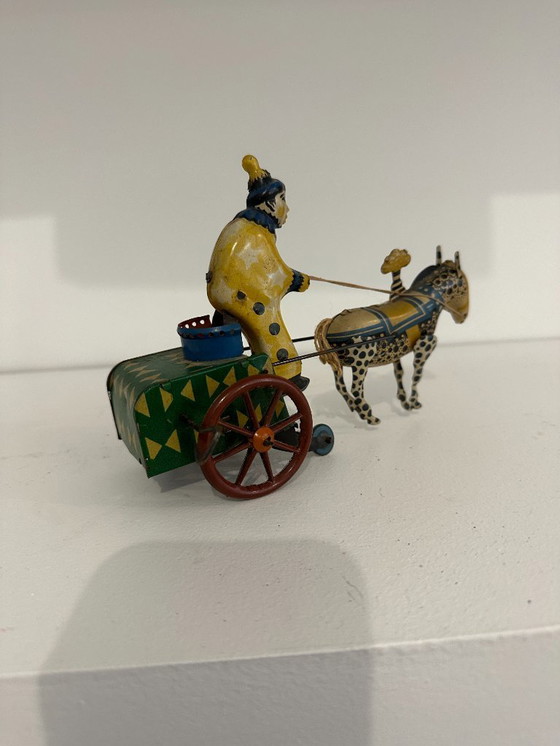 Image 1 of Jouet ancien en tôle lithographiée – Char à âne conduit par un clown