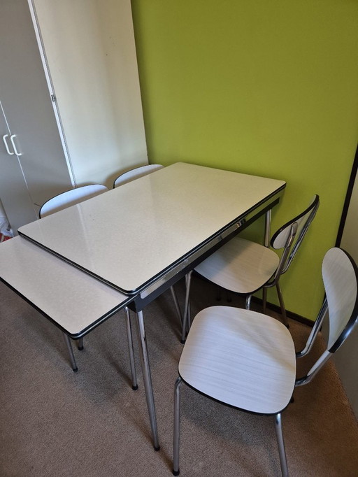 Formica extendable table with 4 chairs from the 1970s