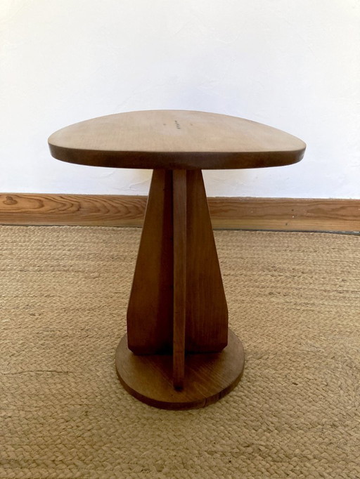 Wooden stool with convex seat