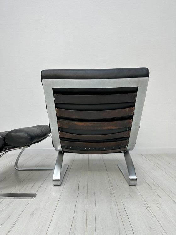 Image 1 of COR Sinus loungestoel en poef in zwart leer van Reinhold Adolf & Hans-Jürgen Schröpfer – Designicoon uit de jaren 70