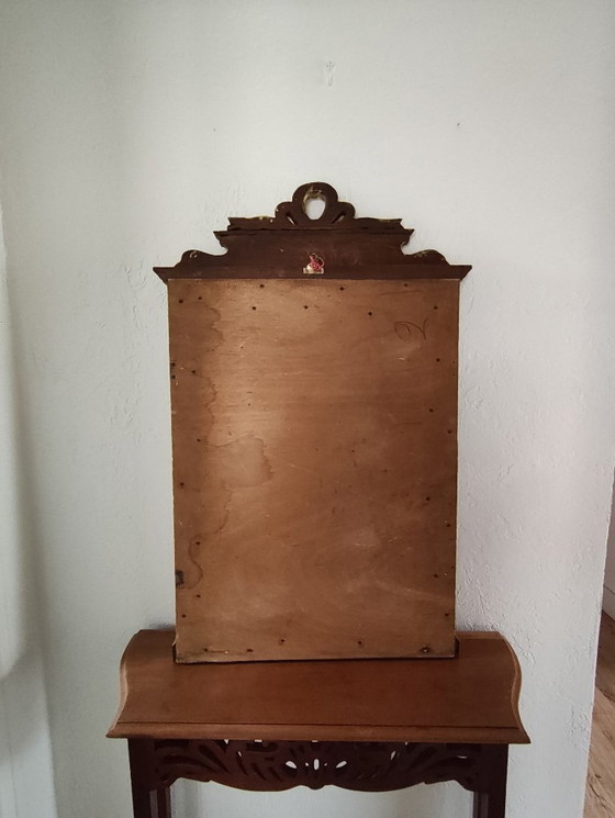 Image 1 of Gilded wooden mirror with carved pediment in the trumeau style