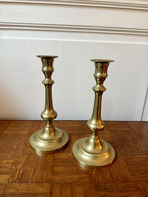 Coppia di candelieri in ottone dorato