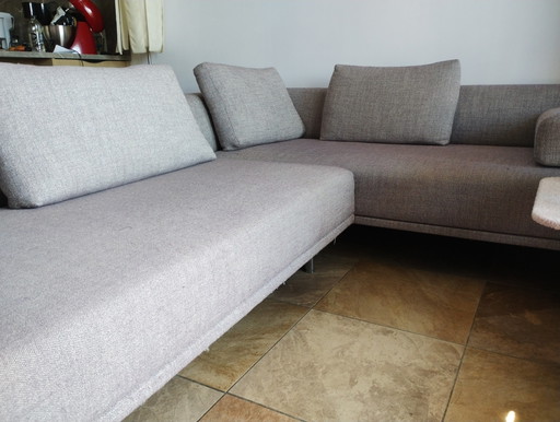 EYYE Ecksofa mit Hocker