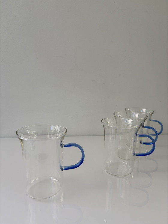 Image 1 of Set of four glass tea mugs with colored handles