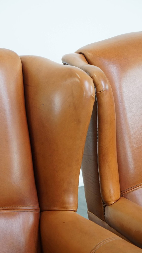 Image 1 of 2x Rundleren oorfauteuil afgewerkt met siernagels