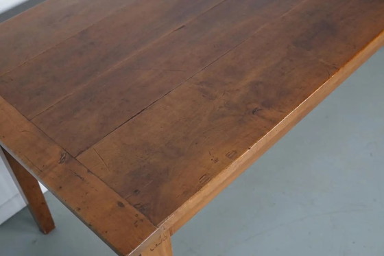 Image 1 of Antiker französischer rustikaler Bauernhaus-Esstisch aus Kirschholz aus dem frühen 20. Jahrhundert