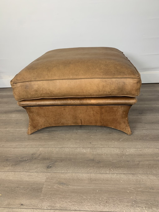 Stoer lederen hocker