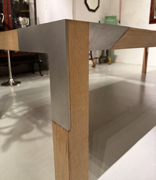 A large oak dining table, designed by Claire Bataille and Paul Ibens