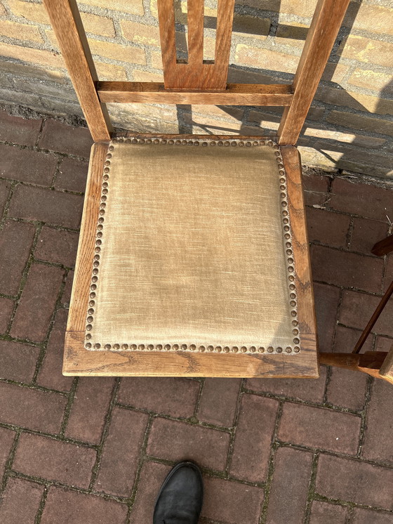 Image 1 of Dining room chairs with fabric seats and nail trim.