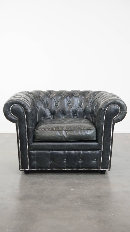 Fauteuil Chesterfield spacieux en cuir de vache noir