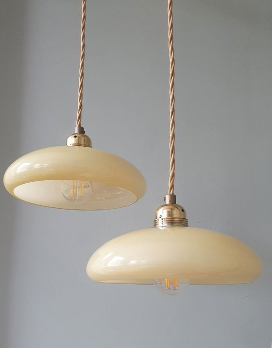 Image 1 of Vintage French pendant lamp set - of pastel yellow opaline glass.