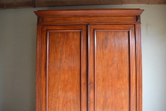 Image 1 of Sleek antique mahogany cabinet.