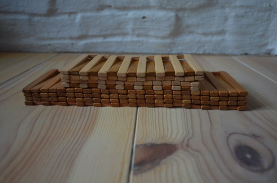 Image 1 of Vintage houten onderzetter, opvouwbaar