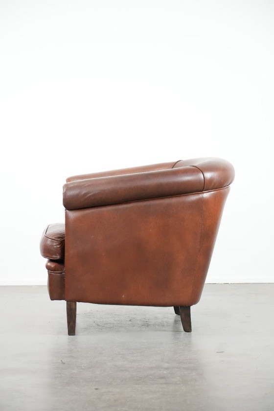 Image 1 of Cognac-colored cowhide leather club armchair in English style with a luxurious appearance