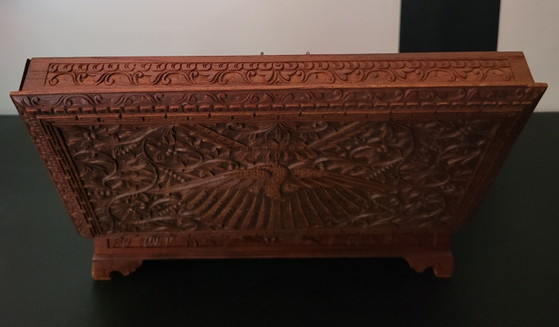 Image 1 of Hand-engraved wooden jewelry box with peacock and floral motifs.